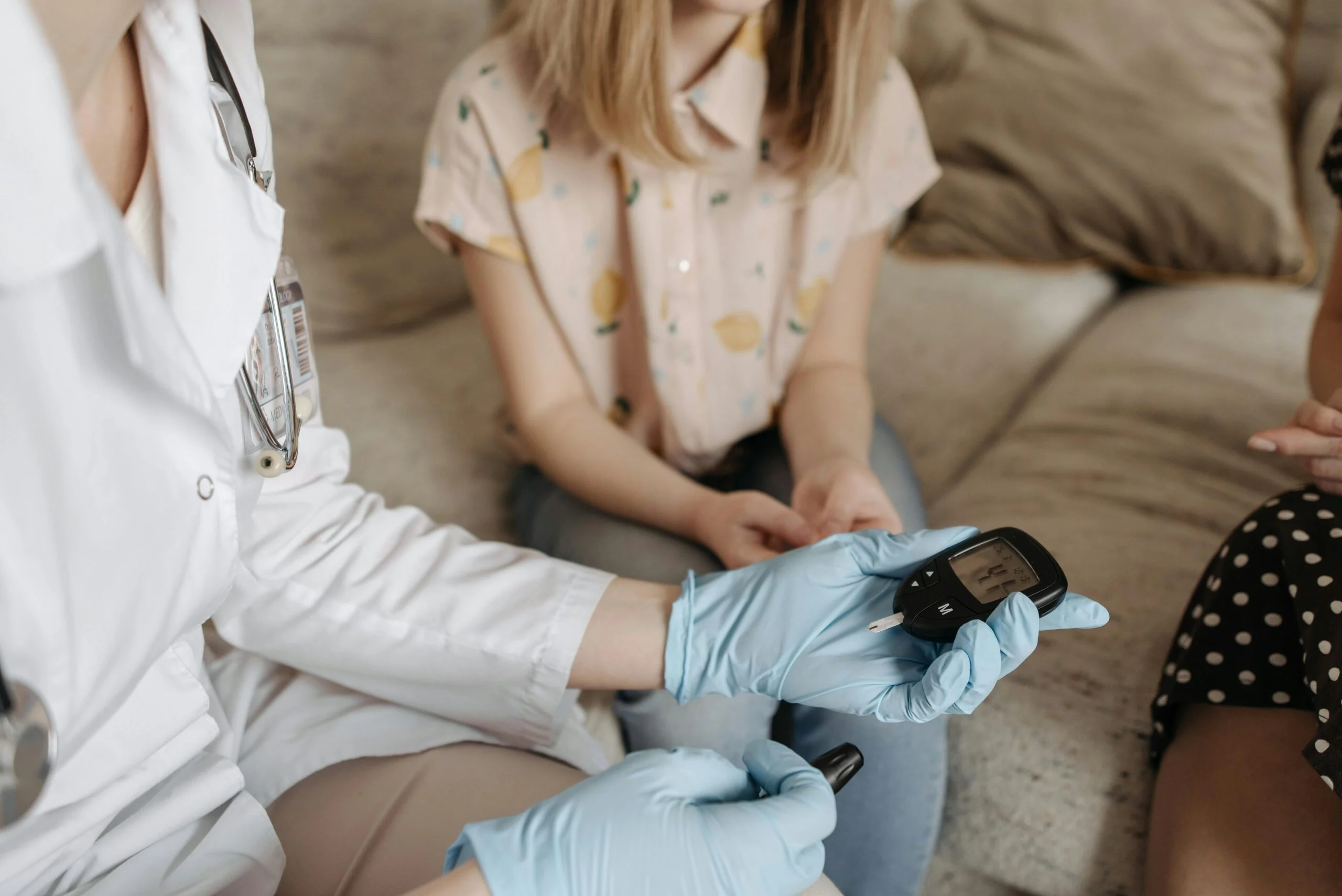 Healthcare worker checking a patient's blood sugar